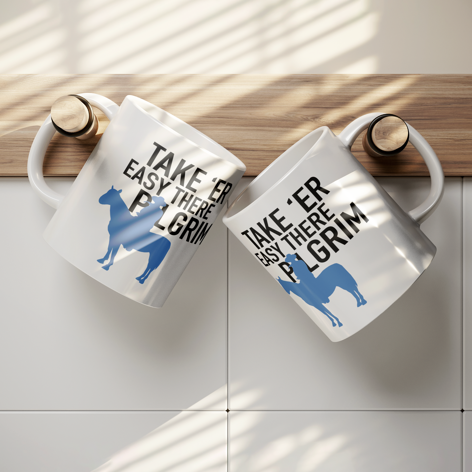 John_Wayne_Inspired_Mug_TAKE_ER_EASY_T_Lifestyle_Hanging_Mockup.png_15541914